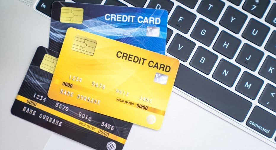 stack of credit cards on keyboard